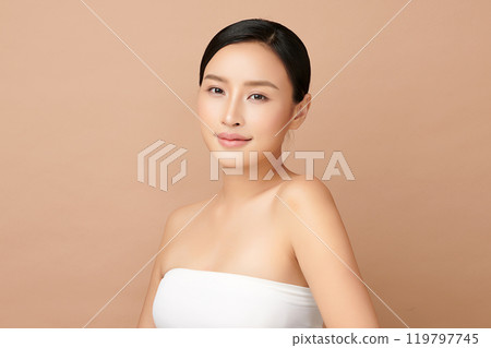 Beautiful young asian woman with clean fresh skin on beige background, Face care, Facial treatment, Cosmetology, beauty and spa, Asian women portrait. Beautiful young asian woman with clean fresh skin on beige background, Face care, Facial treatment, Cosmetology, beauty and spa, Asian women portrait. 119797745