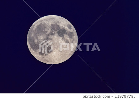 Full moon shining in the dark blue night sky. Full moon shining in the dark blue night sky. 119797785