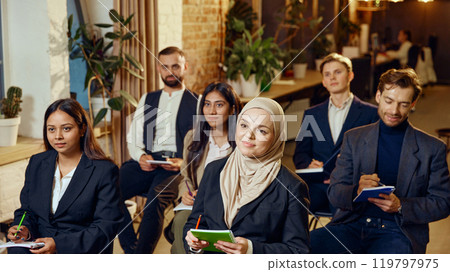 Multicultural people, colleagues meeting in seminar, engaged in learning and discussion. Multicultural people, colleagues meeting in seminar, engaged in learning and discussion. 119797975
