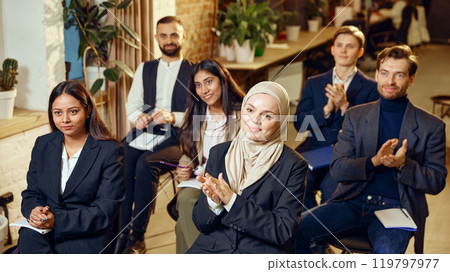 Group of attentive professionals from different backgrounds attending seminar. Moments of learning and professional development Group of attentive professionals from different backgrounds attending seminar. Moments of learning and professional development 119797977