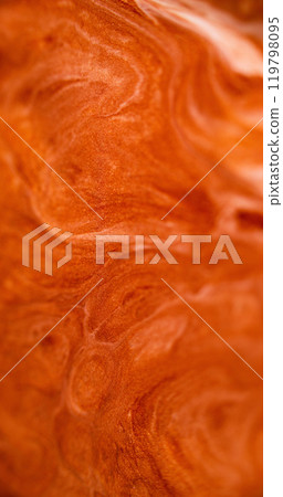 Glitter fluid texture. Paint flow. Defocused orange golden white color glowing shimmering ink spill wave abstract art background. Glitter fluid texture. Paint flow. Defocused orange golden white color glowing shimmering ink spill wave abstract art background. 119798095