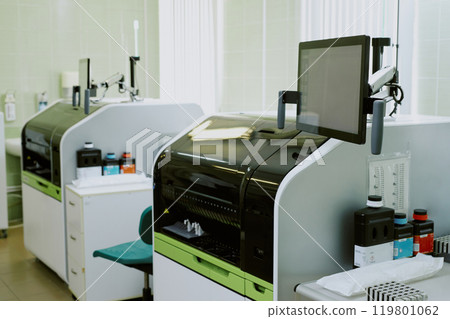 Modern laboratory setting showcasing advanced technological equipment and tools for scientific research. Devices are neatly arranged, enhancing efficiency in a clean environment 119801062