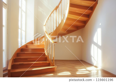 Wooden spiral staircase leading to second floor at modern home 119801196