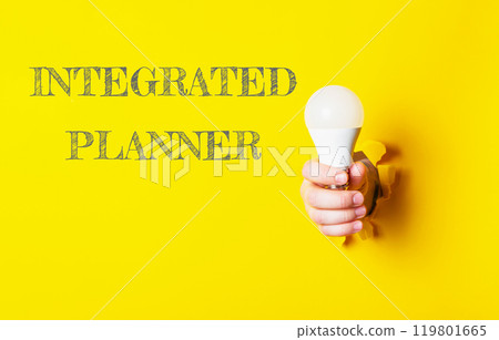 A person holding a light bulb with the words Integrated Planner written below 119801665