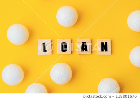 A yellow background with white balls and the word loan written in black A yellow background with white balls and the word loan written in black 119801670