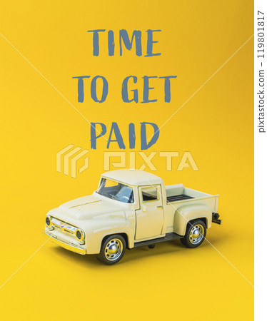 A toy truck with the words Time to get paid written on it A toy truck with the words Time to get paid written on it 119801817