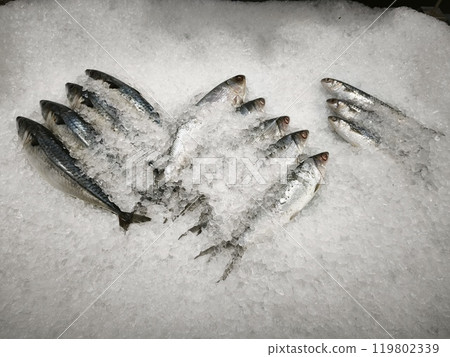 Fresh fish on ice, displayed in a market. Fresh fish on ice, displayed in a market. 119802339