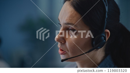 Mental health line: Close up of Caucasian hotline specialist in headset talking to person Mental health line: Close up of Caucasian hotline specialist in headset talking to person 119803320