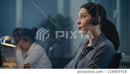 Close up of Caucasian female crisis hotline worker providing psychological help Close up of Caucasian female crisis hotline worker providing psychological help 119803416