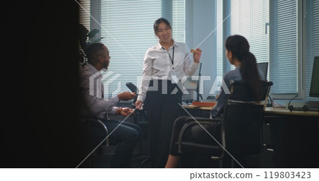 Team of diverse company employees talk and eat pizza delivery for lunch Team of diverse company employees talk and eat pizza delivery for lunch 119803423