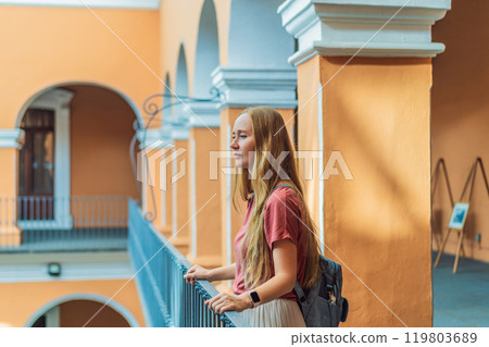 Female tourist in the Biblioteca Palafoxiana, Palafoxiana Library, Puebla, Mexico. Cultural exploration, history, and travel experience concept 119803689