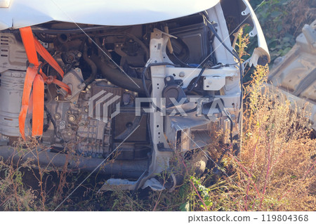 Car accident. Hood and engine compartment of car after a strong crash. Front part of car is gutted. 119804368