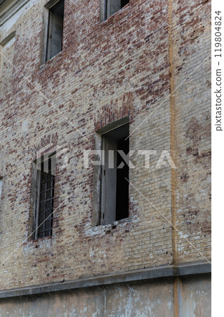 An abandoned building with no windows. An old abandoned, forgotten building 119804824