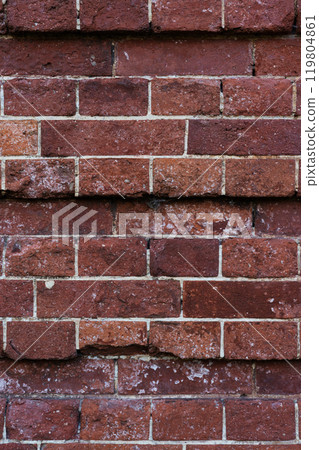 The brick wall of the castle is damaged. Brick wall background. Brick background The brick wall of the castle is damaged. Brick wall background. Brick background 119804861
