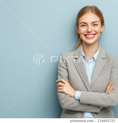 smiling beautiful businesswoman in business suit on blue background smiling beautiful businesswoman in business suit on blue background 119805725
