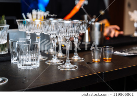 Enjoying alcohol tasting and cocktail preparation at a vibrant bar Enjoying alcohol tasting and cocktail preparation at a vibrant bar 119806801