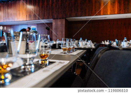Group of tasting glasses set for cocktail preparation event at a venue Group of tasting glasses set for cocktail preparation event at a venue 119806810