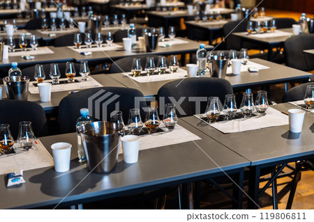 Exploring diverse flavors at an alcohol tasting event in a stylish venue 119806811