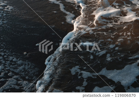 Waves reflecting the autumn sunrise in Shinmaiko 119806870