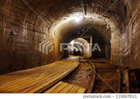 A Journey Through the Dark and Mysterious Mine Tunnel with Abandoned Rusty Rails of the Past A Journey Through the Dark and Mysterious Mine Tunnel with Abandoned Rusty Rails of the Past 119807013
