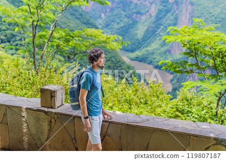 Male tourist exploring Sumidero Canyon National Park, Mexico. Adventure, natural exploration, and travel experience concept 119807187