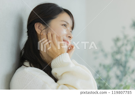 Woman in white knit Woman in white knit 119807785