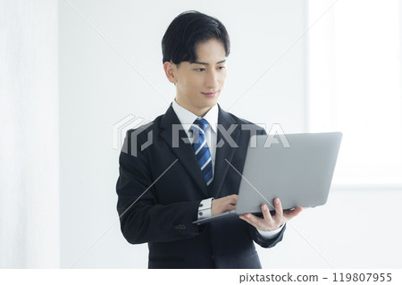 A thoughtful young businessman A thoughtful young businessman 119807955