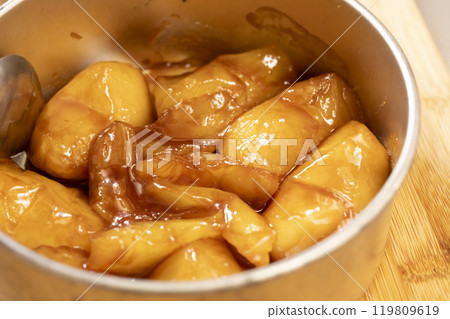 Tarte Tatin apples cooked in butter and sugar 119809619