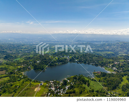 Lake Sebu in South Cotabato, Philippines. Tropical Landscape with blue sky and clouds. Mindanao. Lake Sebu in South Cotabato, Philippines. Tropical Landscape with blue sky and clouds. Mindanao. 119809960
