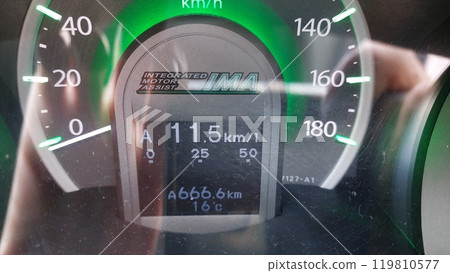 The number of the engine on the speedometer of the car The number of the engine on the speedometer of the car 119810577