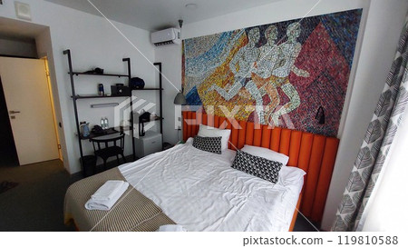 Hotel room with bed and mosaic Hotel room with bed and mosaic 119810588