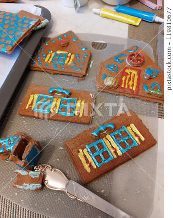Kids make a gingerbread house Kids make a gingerbread house 119810677