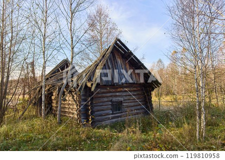 Old, Crumbling Russian Bathhouse in Autumn Landscape 119810958