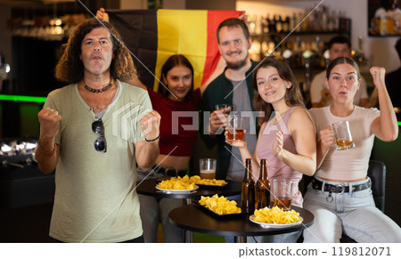 Group of fans in bar with Belgian flag Group of fans in bar with Belgian flag 119812071