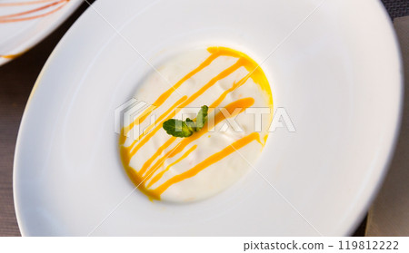 Sweet dessert cream yougurt withtropical passion fruit at plate 119812222