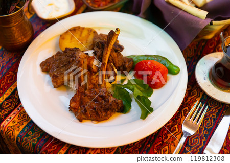 A traditional Turkish dish of lamb ribs called Kuzu Pirzola. 119812308