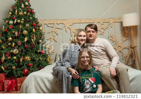 happy fun family girl couple celebration gift bed new tenderness year love positive holiday man 119812321