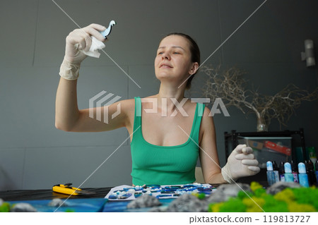 The process of making the art decor of epoxy resin, natural stones and moss 119813727