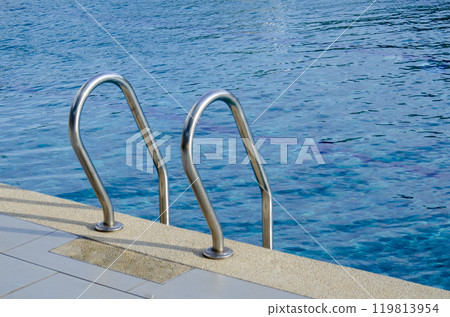 Swimming pool view at a resort in Bali. Travel and holiday concept Swimming pool view at a resort in Bali. Travel and holiday concept 119813954