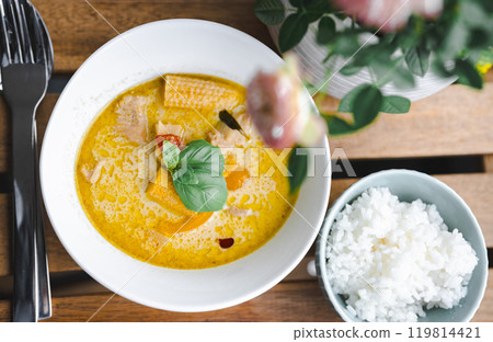 A delicious combination of authentic Thai green curry and rice 119814421