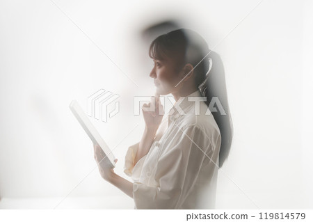 Chef looking at tablet (blurred) Chef looking at tablet (blurred) 119814579