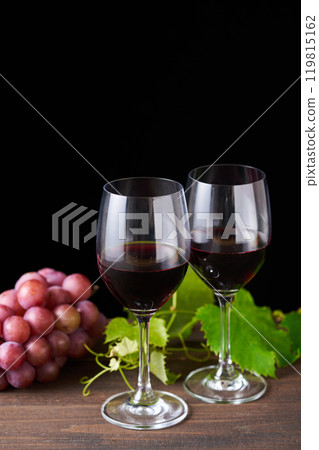 red wine poured into a glass 119815162