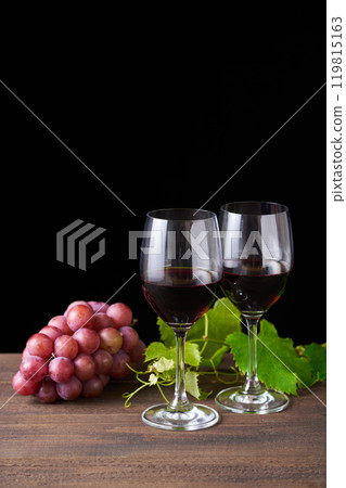 red wine poured into a glass 119815163