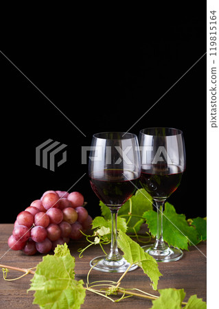 red wine poured into a glass 119815164