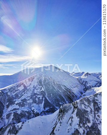 Snowcapped mountains on clear winter frosty sunny day 119815170