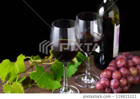 red wine poured into a glass 119815221