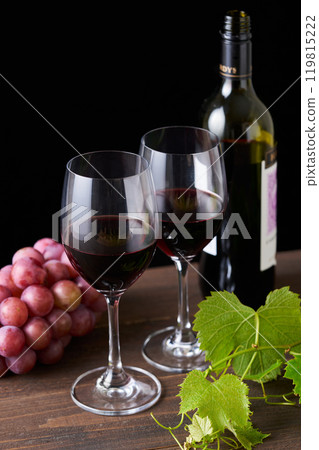 red wine poured into a glass 119815222