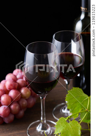 red wine poured into a glass red wine poured into a glass 119815223