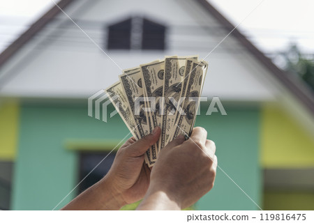 Hand holding loan money dollar bank note give financial payment. Man hands showing spread 100 dollar exchange cash payout. Saving Businessman counting money banknote bribe corruption concept. Hand holding loan money dollar bank note give financial payment. Man hands showing spread 100 dollar exchange cash payout. Saving Businessman counting money banknote bribe corruption concept. 119816475