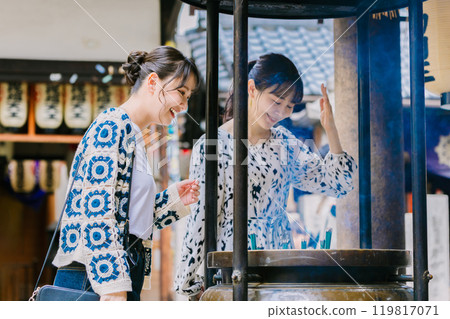 Worshippers bathing in smoke from the incense burner 119817071